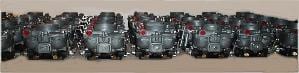 A row of multiple Zenith 32 NDIX carburetors lined up side by side.