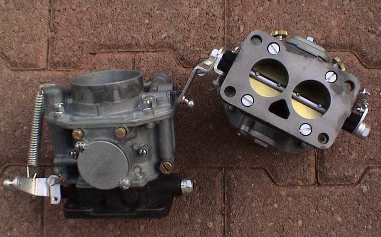 Two Zenith 32 NDIX carburetors, one shown from the side and one from the top showing the twin throats.